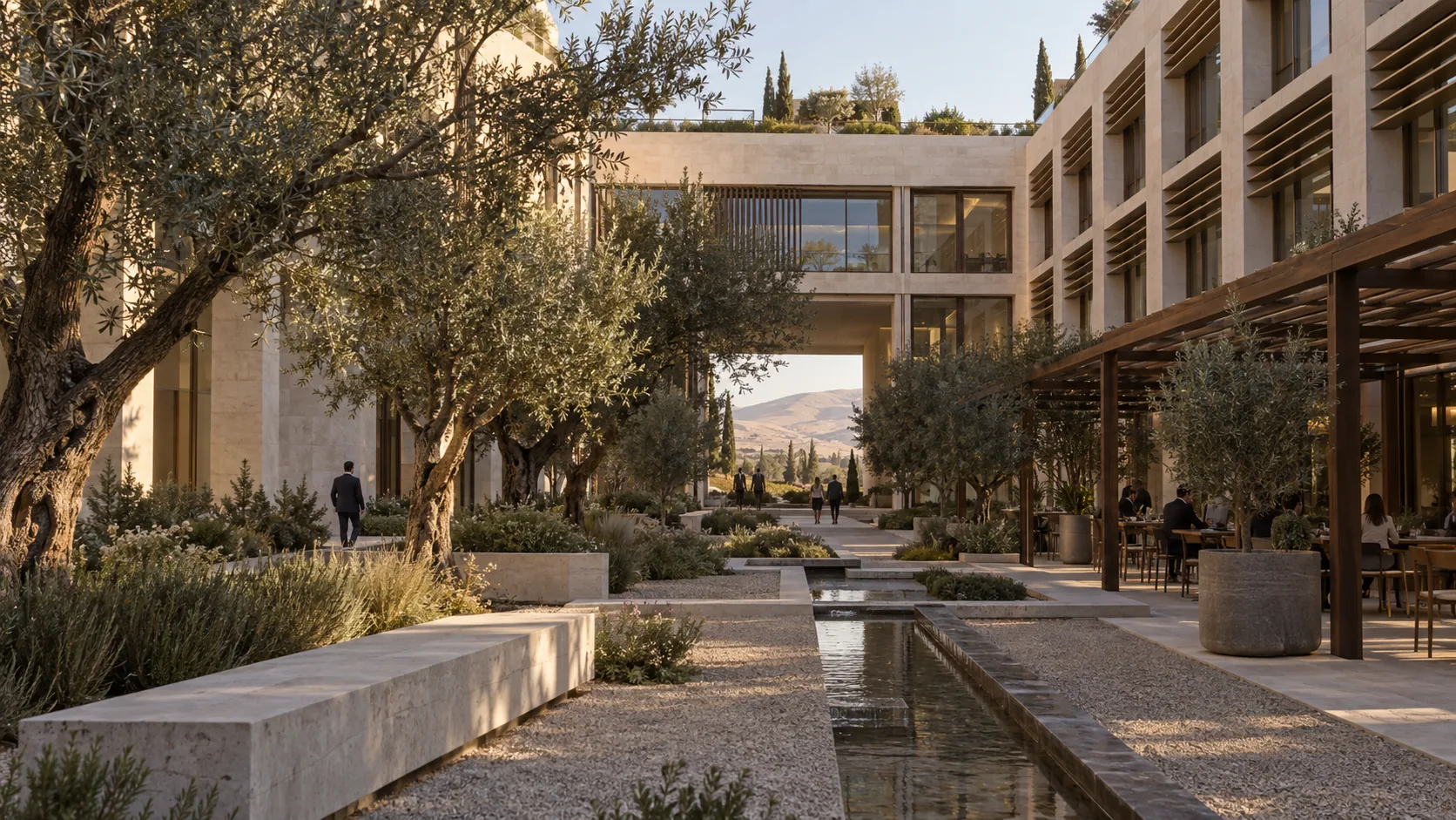 Cada uno de los cuatro patios es antes que nada un jardín: sombra, agua y un café entre las oficinas.